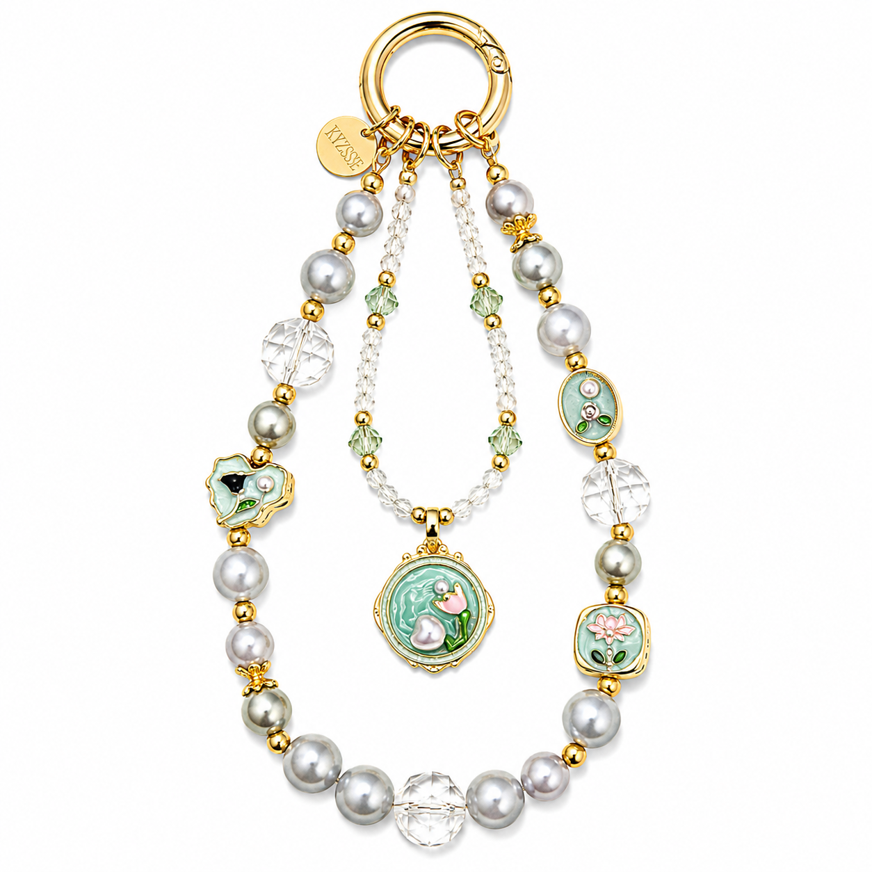 A gold-tone key ring bag charm featuring faux pearls, clear crystal beads, and multiple green enamel medallions with floral and bird motifs, shown on a plain white background.