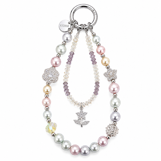 A multi-strand pearl and crystal keychain necklace with a silver ring clasp, featuring pastel pink, white, and silver pearls, crystal flower and star charms, a silver tree of life pendant, and a round silver brand tag engraved with 'KYZSSE'